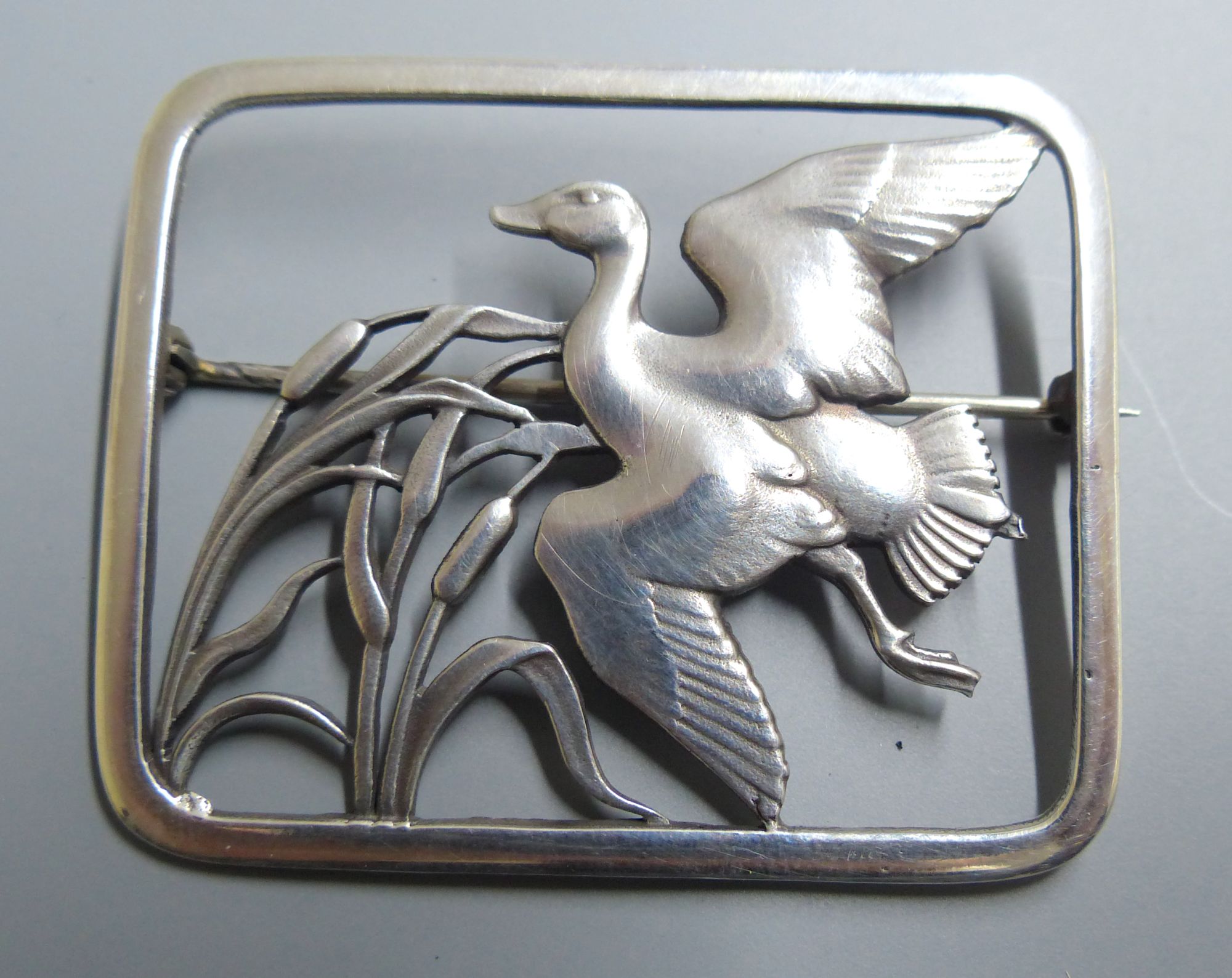 A Georg Jensen sterling Flying duck amid bulrushes rectangular brooch, no. 300, 47mm.
